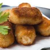 A plate with homemade croquettes decorated with parsley